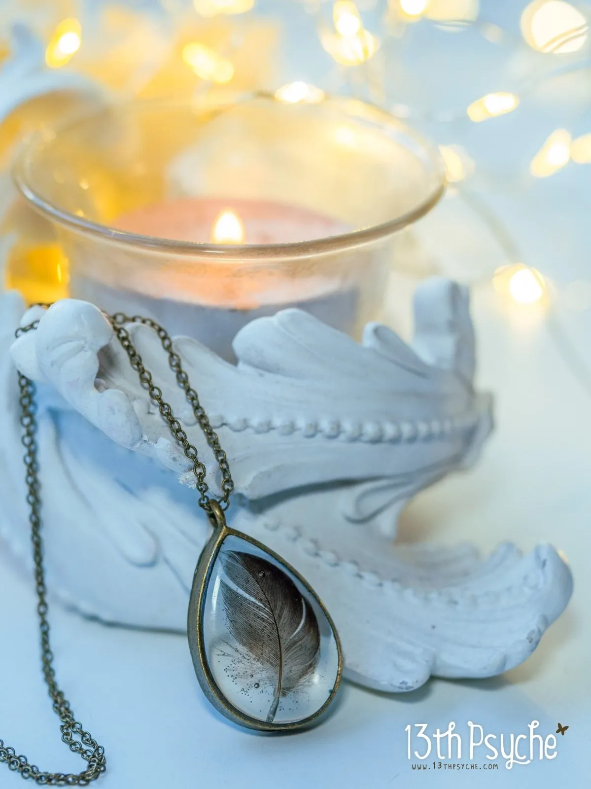 Drop shaped resin pendant with real feather necklace