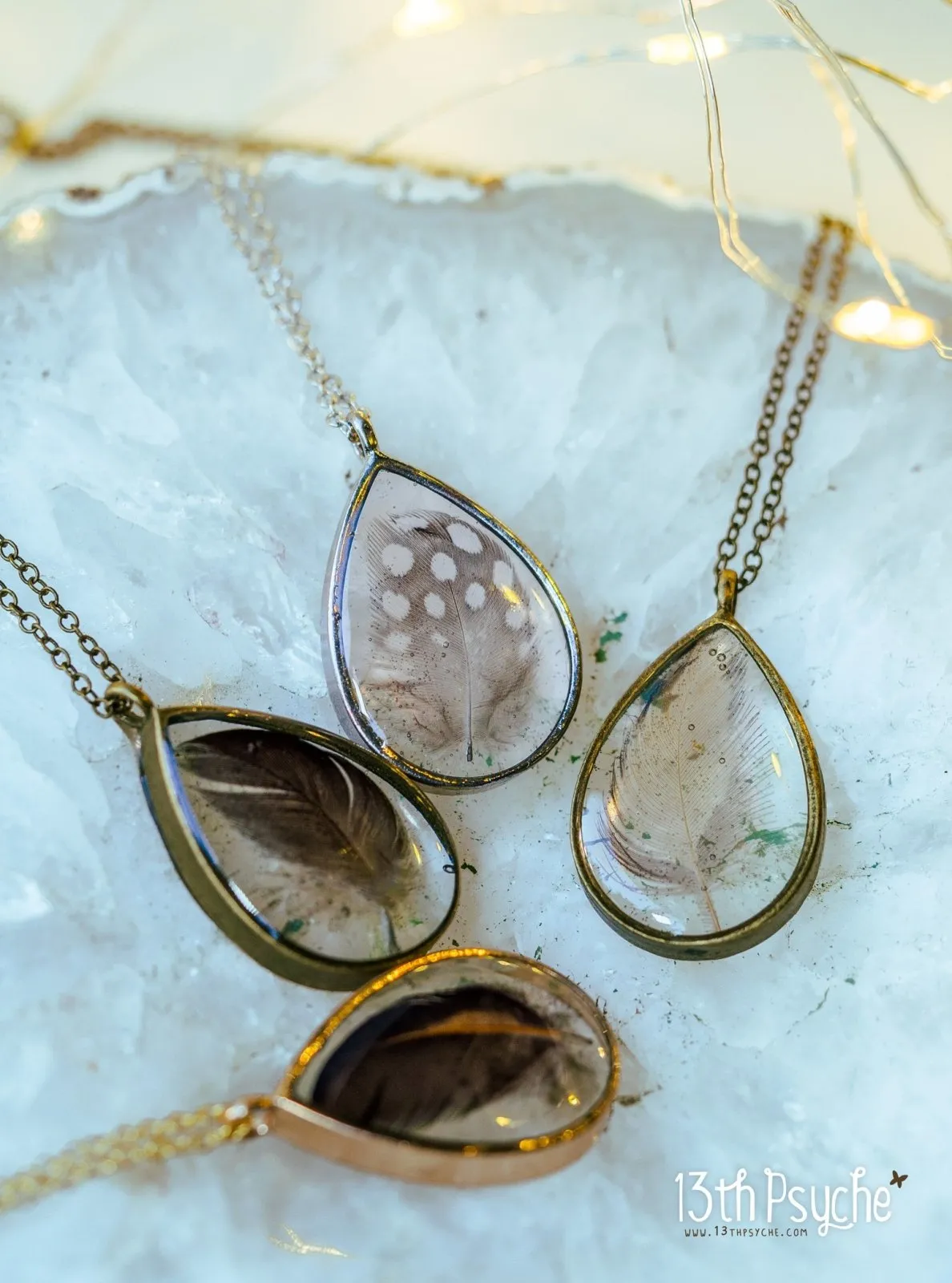 Drop shaped resin pendant with real feather necklace