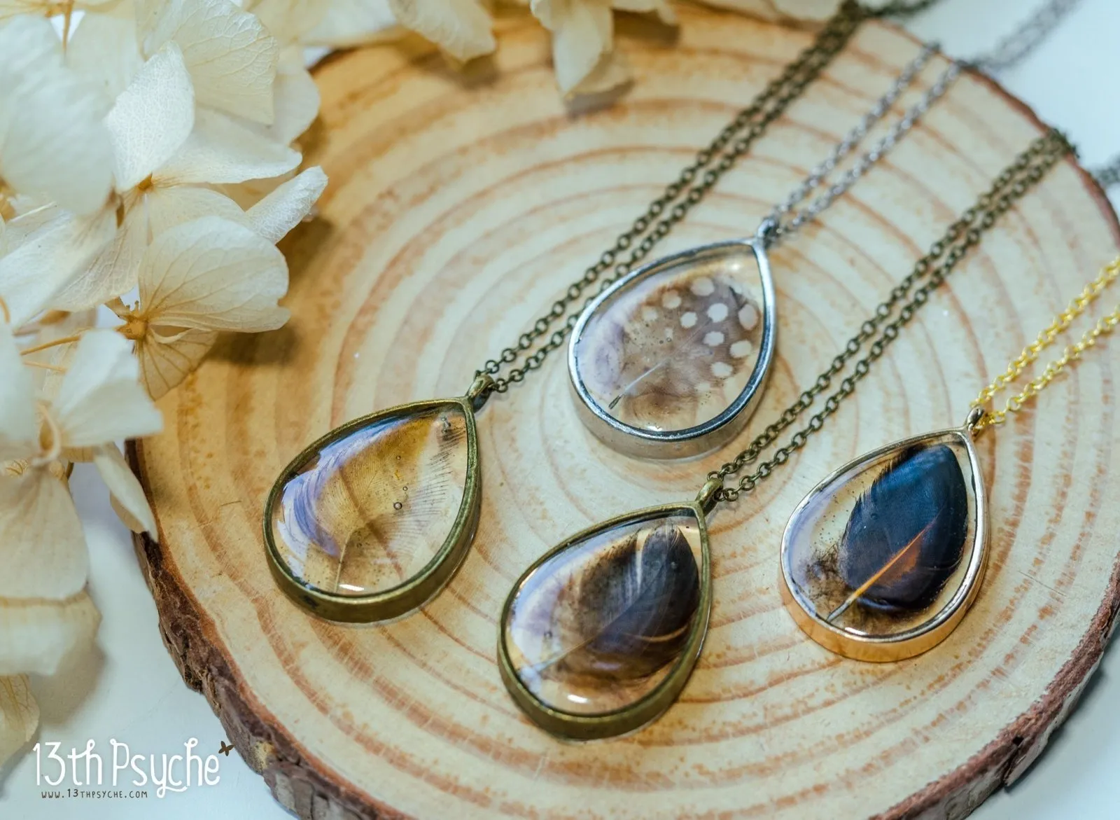 Drop shaped resin pendant with real feather necklace